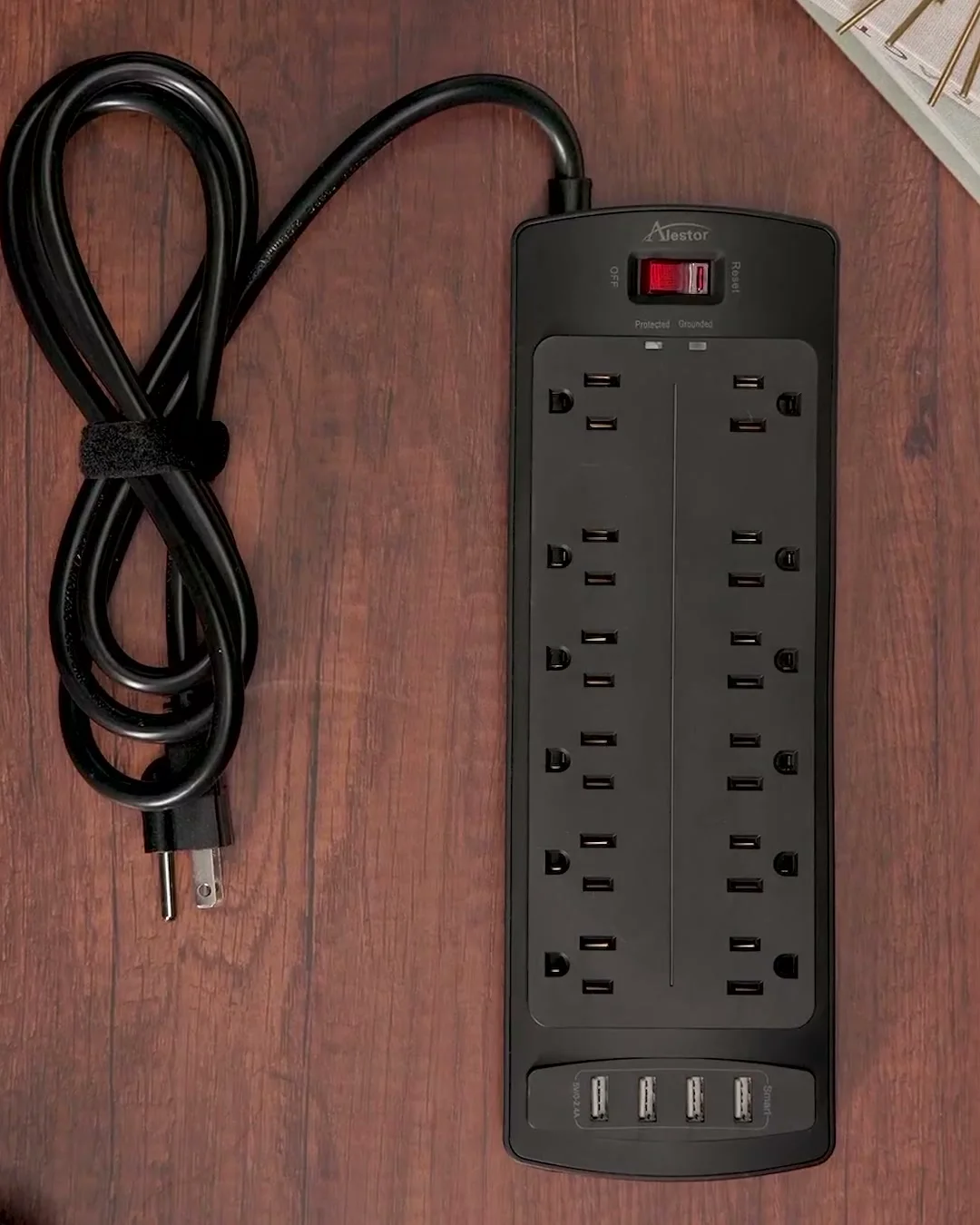 The 6 ft black strip on a desk: switch, lights, the side profile and the keyhole slots on the back.